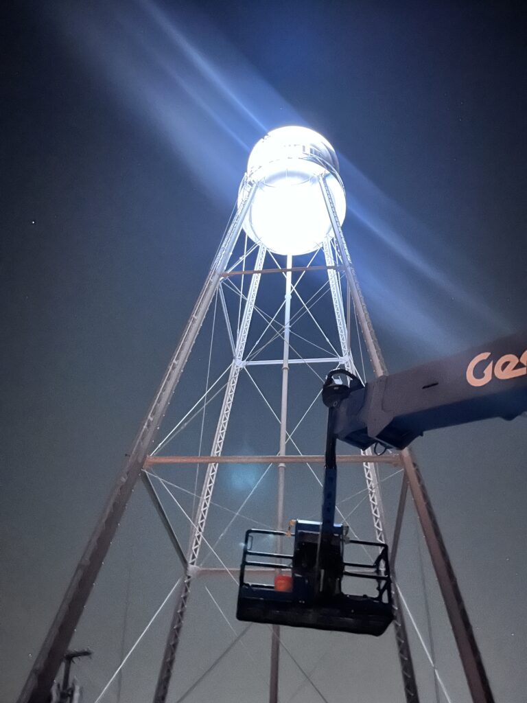 Pflugerville historic water tower all lit up